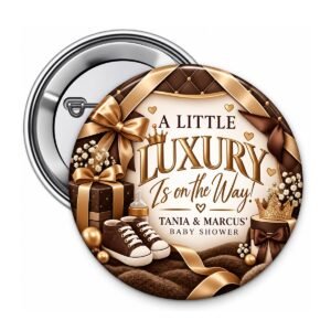 Brown and gold luxury baby shower button with gold ribbons, baby shoes, crown, and custom baby shower wording.