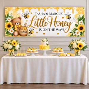 Personalized bumble bee baby shower banner with honey-yellow watercolor bees displayed on a wall above a party table