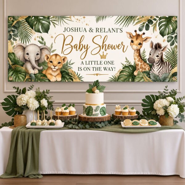 Personalized safari baby shower banner with watercolor jungle animals and sage greenery displayed above a party table