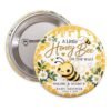 Honey Bee baby shower button featuring a cute yellow bumble bee, golden honeycomb, dripping honey, white daisies, and A Little Honey Bee Is on the Way wording.