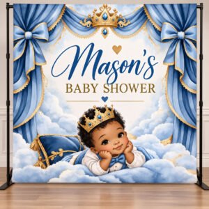 Personalized Little Prince baby shower backdrop featuring an African American baby prince, royal blue curtains, gold crowns, and watercolor clouds.
