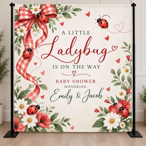Personalized ladybug baby shower backdrop with red watercolor ladybugs, garden florals, and A Little Ladybug Is on the Way lettering