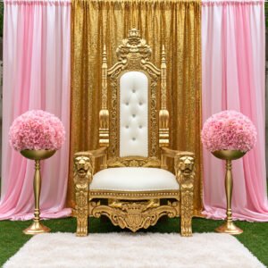 Gold and ivory throne chair with pink draping, gold sequin backdrop and floral centerpieces for an elegant party rental package on Long Island