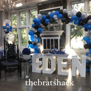 name table and balloon arch at coral house by the brat shack