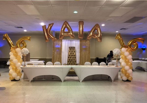 Sweet 26 balloon column and name arch