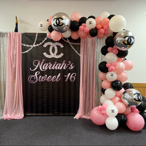 Chanel Backdrop and balloon arch the brat shack