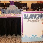 the brat shack beach theme sweet 16 candelabra and sign in board