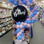 The Brat Shack question balloon gender reveal display