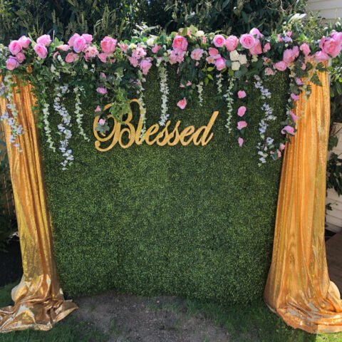 the brat shack green wall with flowers