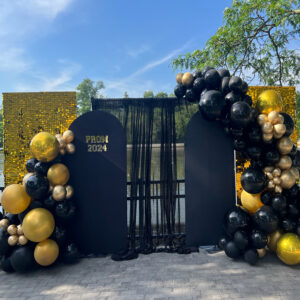 Grand Prom Backdrop and jumbo balloon garland set up The Brat Shack