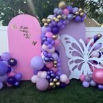 The Brat Shack butterfly backdrop baby shower
