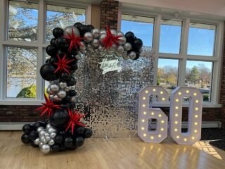 60th Birthday Shimmer Wall with Black & Silver Balloon Garland & Marquee Numbers