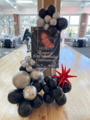 60th Birthday Welcome Sign with Black & Silver Balloon Garland