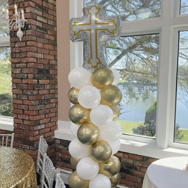 elegant Gold & white Cross balloon column the brat shack