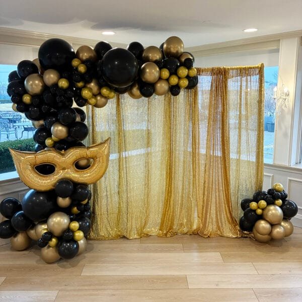 masquerade balloon garland with gold sequins backdrop