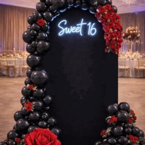 black balloon wall garland and flowers the brat shack