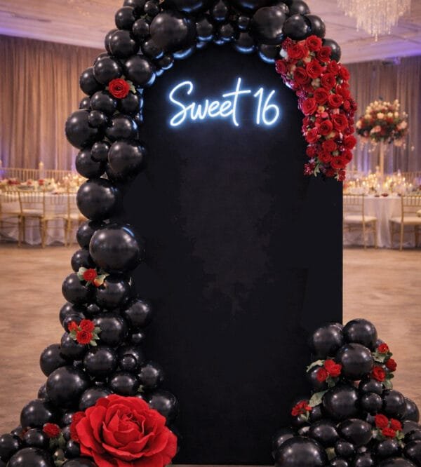 black balloon wall garland and flowers the brat shack