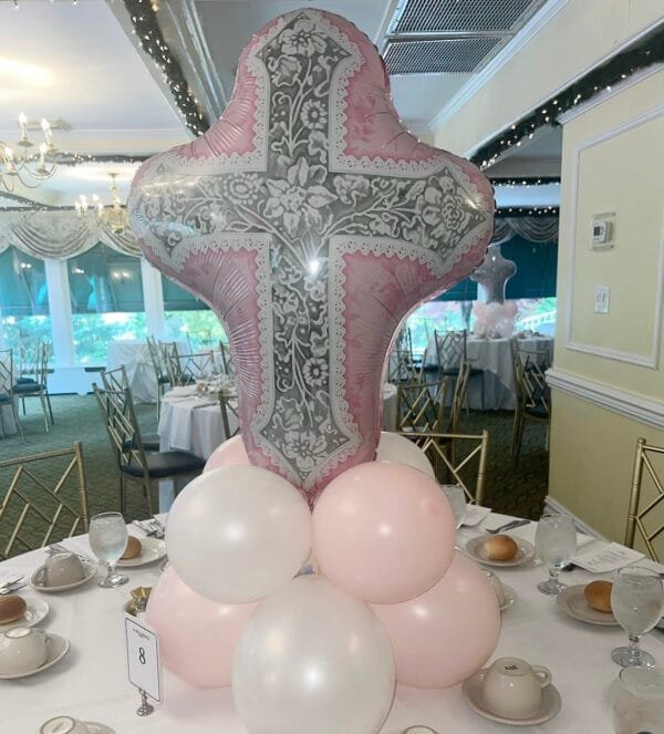 pink cross balloon table centerpiece