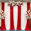 red and white floral draped fabric backdrop