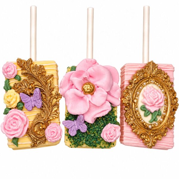 Enchanted floral chocolate covered Rice Krispies Treats decorated with pink roses, butterflies, green accents and ornate gold frames.
