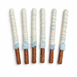 Six baby blue chocolate covered pretzel rods with white coating, blue drizzle, pearl sprinkles and baby-themed decorations
