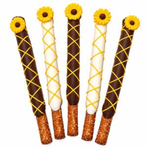 Sunflower chocolate covered pretzel rods decorated with yellow drizzle and sunflower toppers